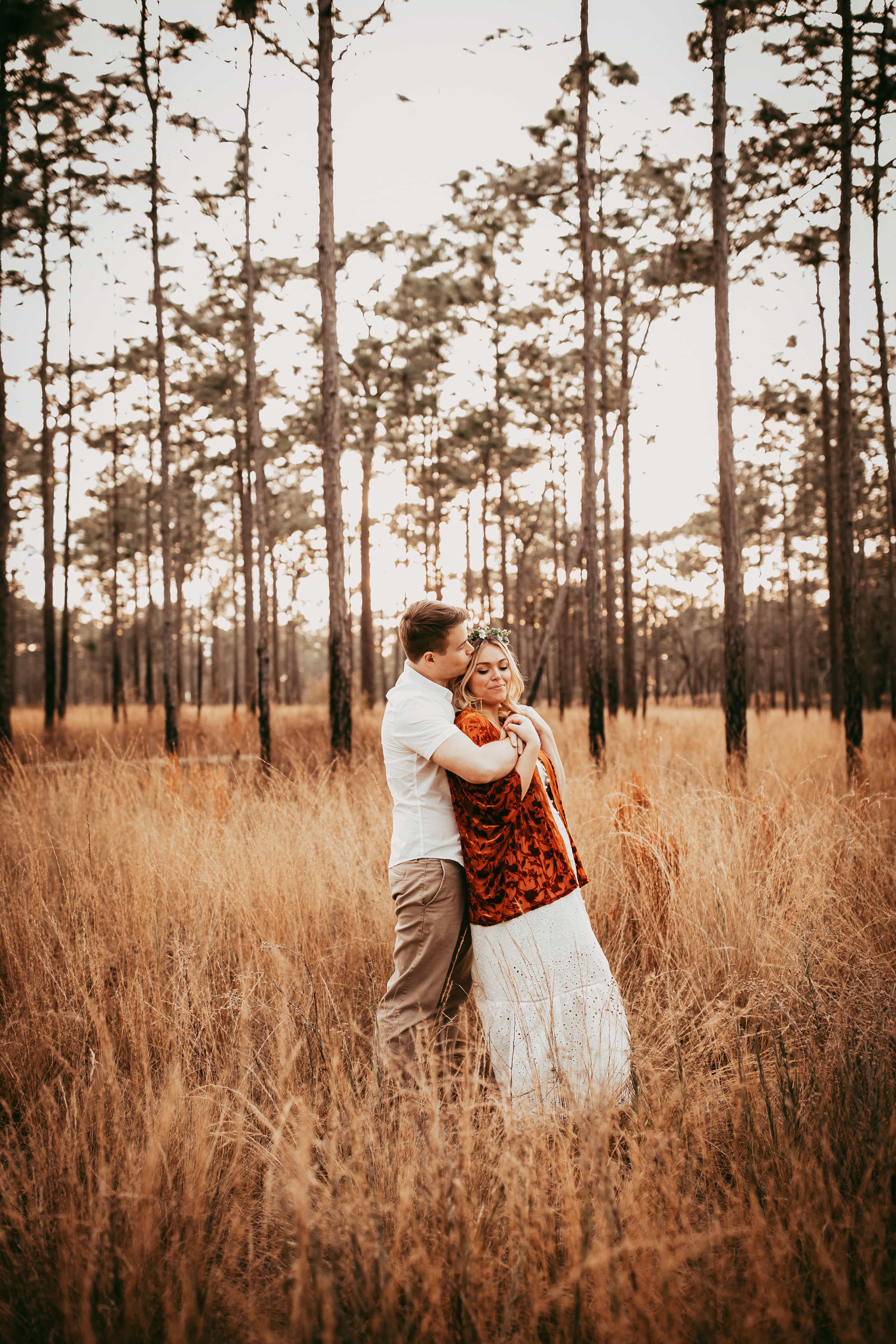 Orlando Couples Photography, couple cuddled up together in a field