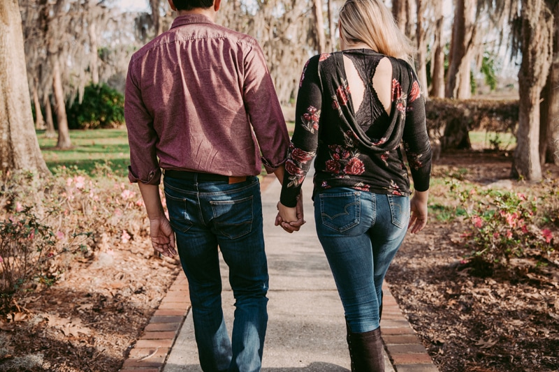 Orlando Couples Photography, Couple walking hand in hand down a paved path